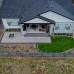 Backyard with hardscaping and a fire pit