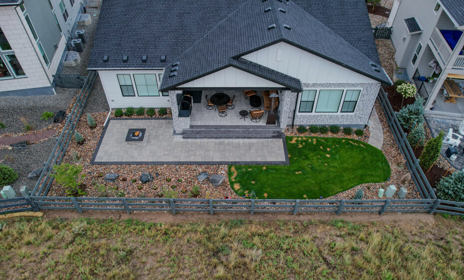 Backyard with hardscaping and a fire pit