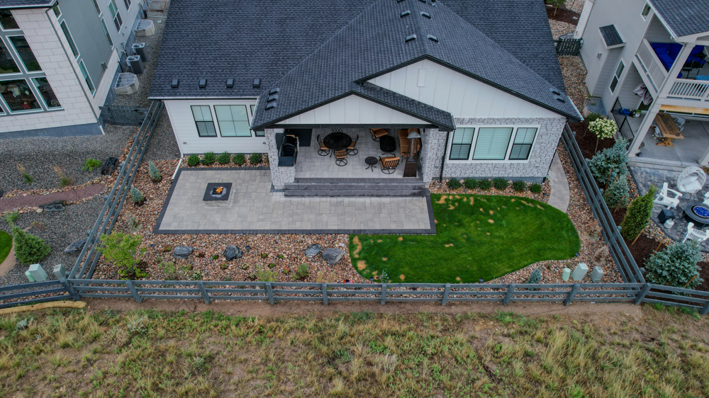 Backyard with hardscaping and a fire pit